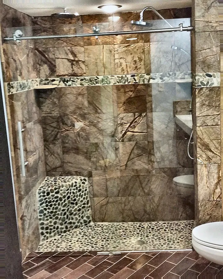 A mix of natural-look tile, mosaic and glass.