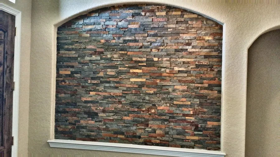 A textured stone inset framed by a soft arch.