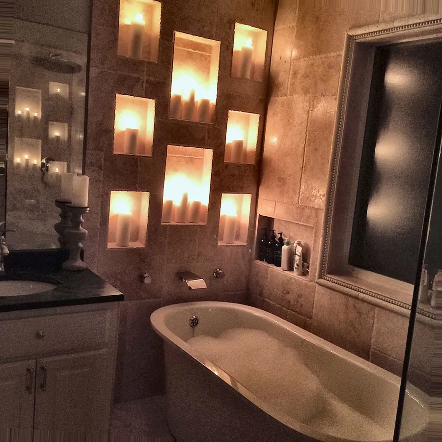 Warm interior lighting around a built-in bathing area.