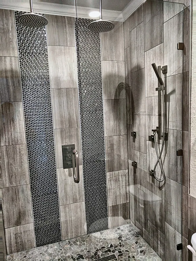 Light stonework with dark vertical feature strips.